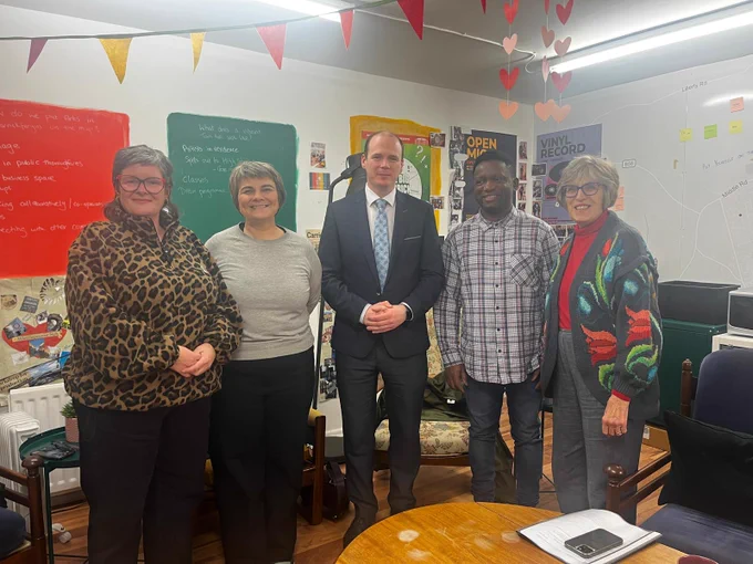Minister Lyons is pictured with members of Positive Carrickfergus
