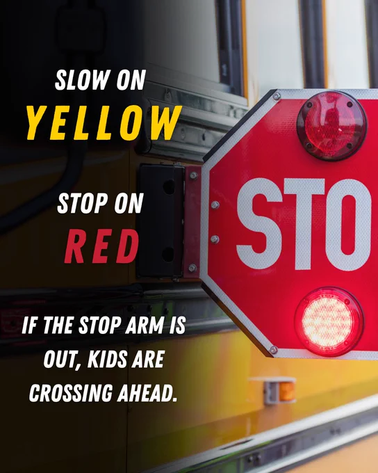 A close-up image of the stop sign of a school bus with text reading "Slow on Yellow, Stop on Red" and a warning that reads "If the stop arm is out, kids are crossing ahead.