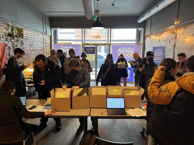 A photo of volunteers and canvassers in the campaign office