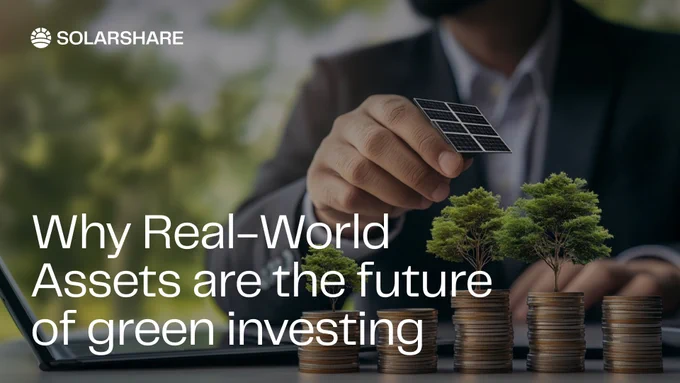 A man in a suit sitting at a table with his laptop and placing a solar panel on a bunch of stacked coins on which miniature trees are growing