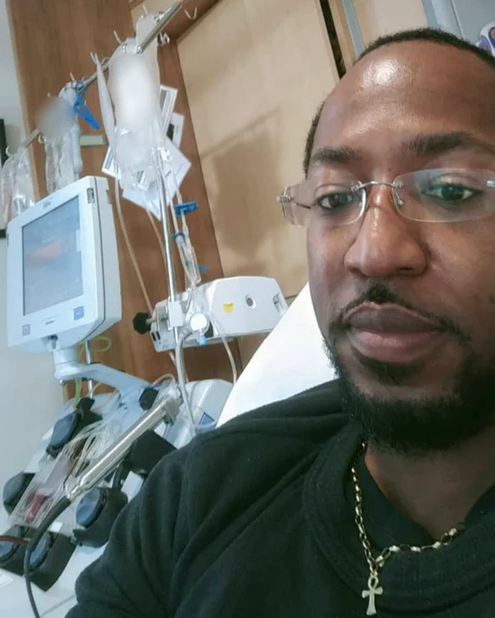Rommell taking a selfie with hospital machinery in the background
