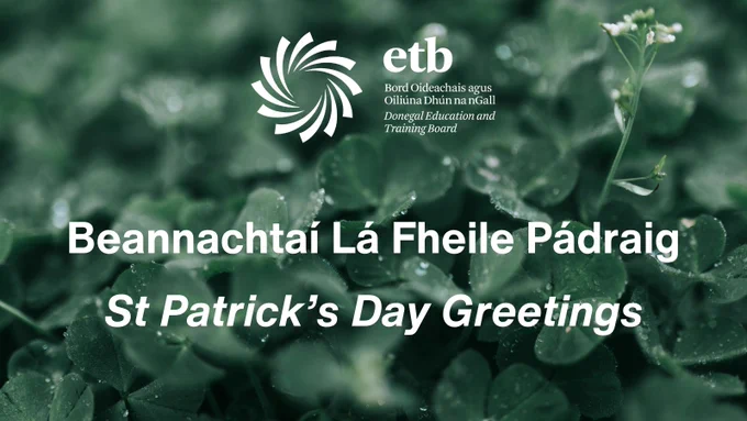 Shamrocks with St Patrick's Day greetings in English and Irish. 