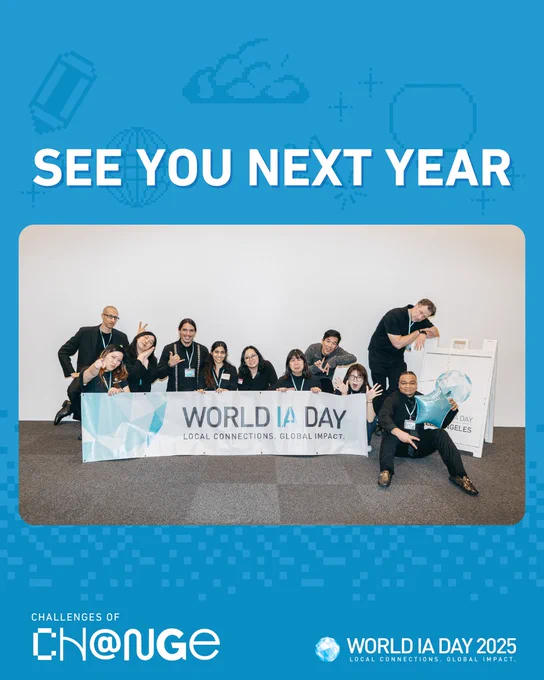 Group of people smiling and posing with a World IA Day banner. Text above reads See You Next Year. Graphic elements and logos are present on a blue background.