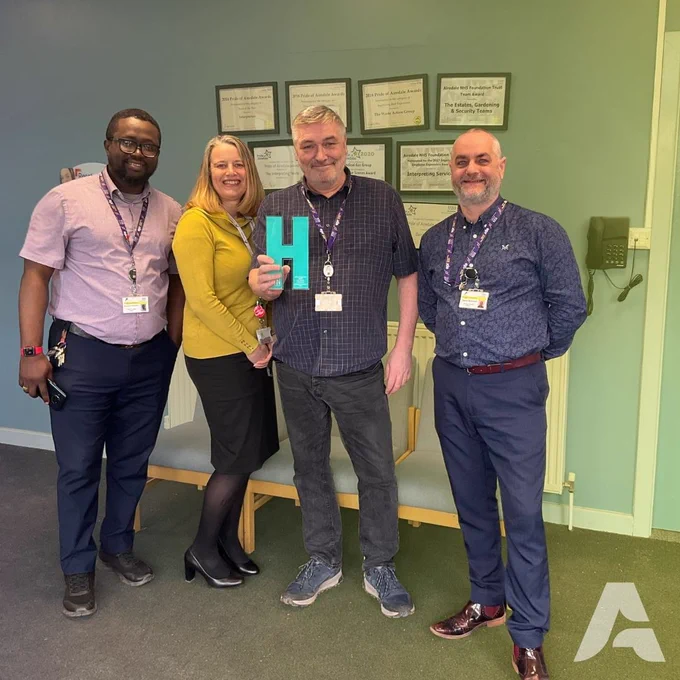 4 members of our estates team with their trophy