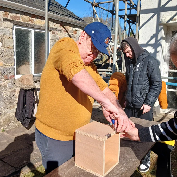 Busy building a compost bin from wood