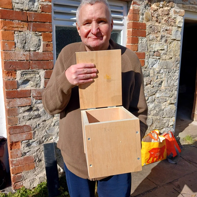 Half way creating his wooden compost bin