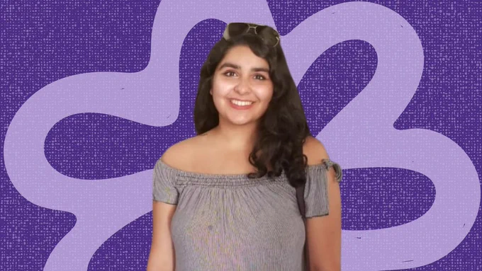 Headshot of Karishma Manglani in front of a purple background and flower