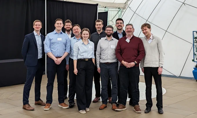 A group of ten people standing