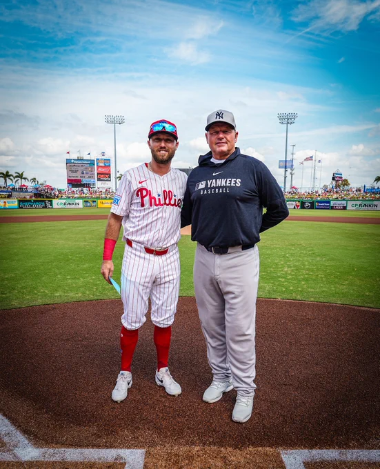 Kody and Roger Clemens pose for a photo pregame on the field at BayCare Ballpark