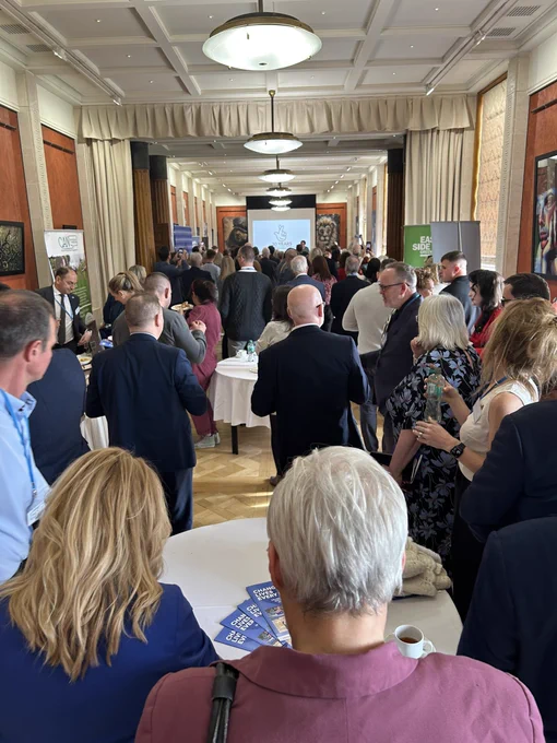 Pic of crowd in long gallery gathered to celebrate lottery 30th birthday