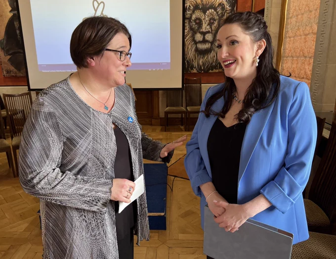 Image of two people - Kate Beggs, NI director of the National Lottery Community Fund, with Deputy First Minister Emma Little-Pengelly at the event in Parliament Buildings celebrating 30 years of National Lottery funding in Northern Ireland.