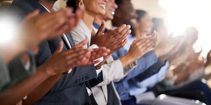 A group of people applauding