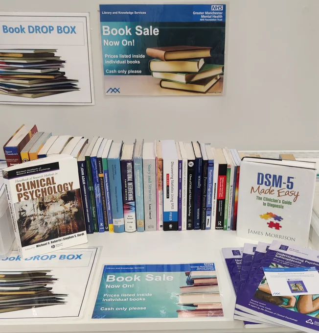 Photograph of the book sale table outside The Curve Library