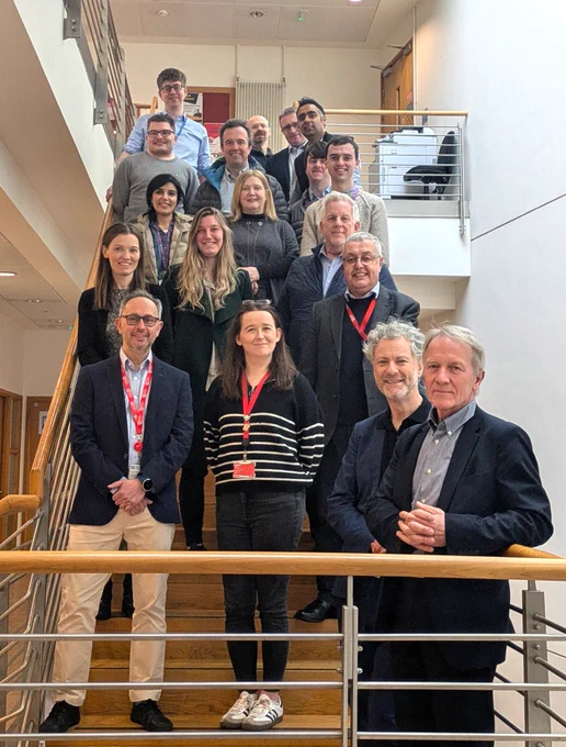 19 Fastman researchers stand on the stair of PGJCCR