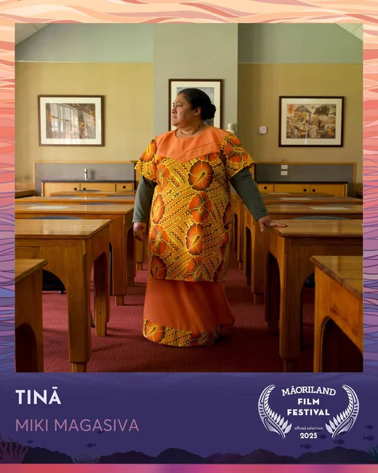 Anapela Polata'ivao stands in a orange, yellow and brown outfit with green long sleeves underneathe. She stands between several classroom desks.  This picture is surrounded by a Māoriland Film Festival back  drop with the words "Tinā - Miki Magasiva - Māoriland Film Festival Official Selection 2025