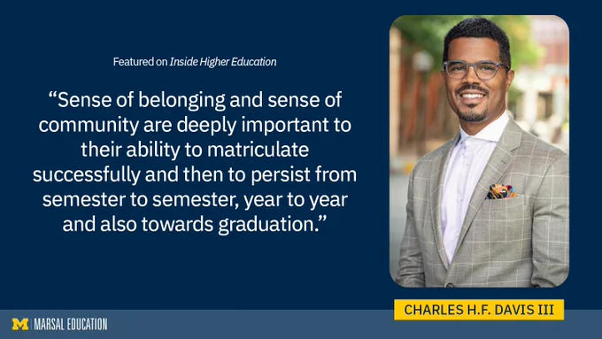 Charles H.F. Davis III, featured in Inside Higher Education, quoted on the importance of belonging and how it contributes to academic success, smiling in a gray suit with a colorful pocket square and glasses.