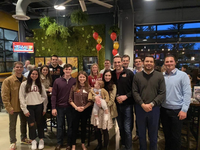 Group of Elon University alumni gathered for a photo at an Elon Day event in Cincinnati. 