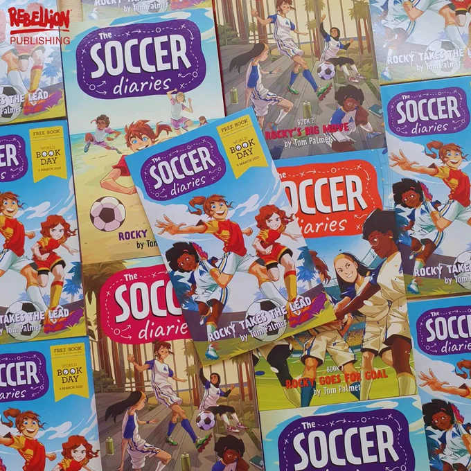 A copy of Rocky Takes the Lead by Tom Palmer lies on a spread of other books from The Soccer Diaries series. The Rebellion Publishing logo is in the top left corner in red.