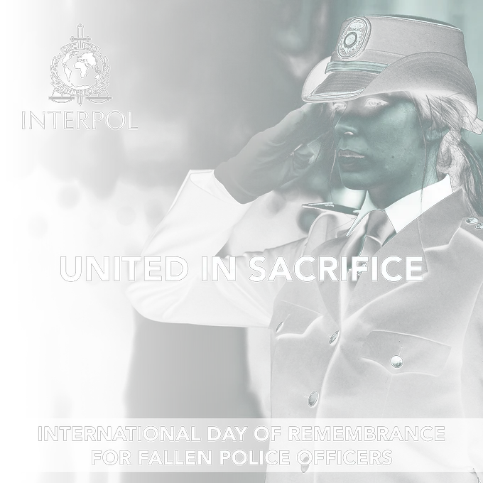 Black & white picture of a female police officer saluting. Text on screen: United in sacrifice. International Day of Remembrance for fallen police officers.