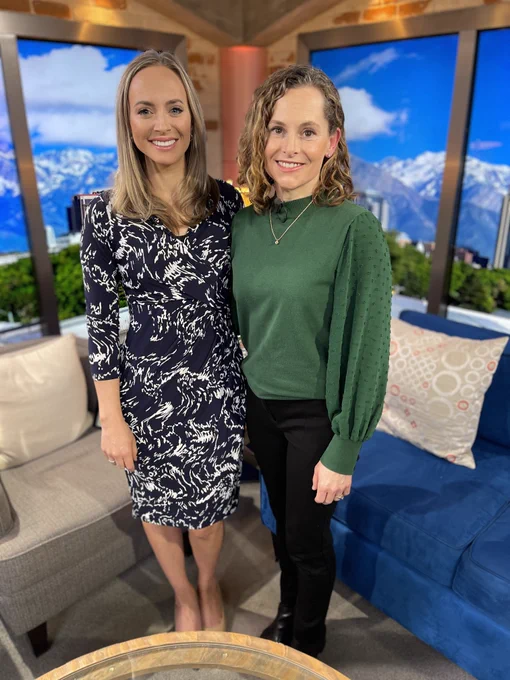 FOX13's The PLACE anchor/host, Morgan Saxton, stands and smiles next to Peak Orthopeadics’ Sports Medicine Physician, Dr. Andrea Matich, in studio. The MountainStar Healthcare orthopedic clinic is located on the campus of Lone Peak Hospital in Draper, Utah.