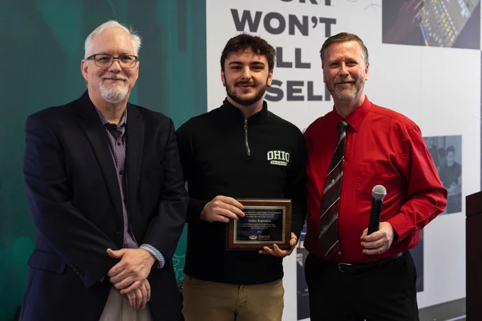 Journalism major Parker Kopronica, center, with Dean Scott Titsworth, left, and WOUB Public Media Director Marker Brewer, right