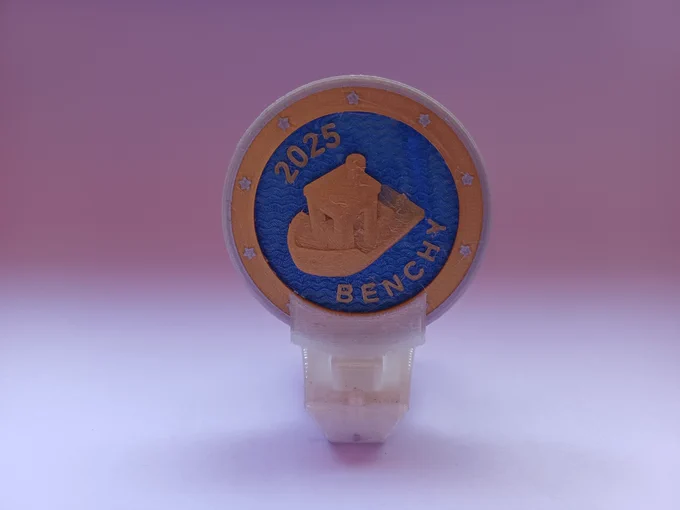 The Benchy coin, as described before, is being carried by a Benchy ship using a special adapter for the cargo box of the ship.