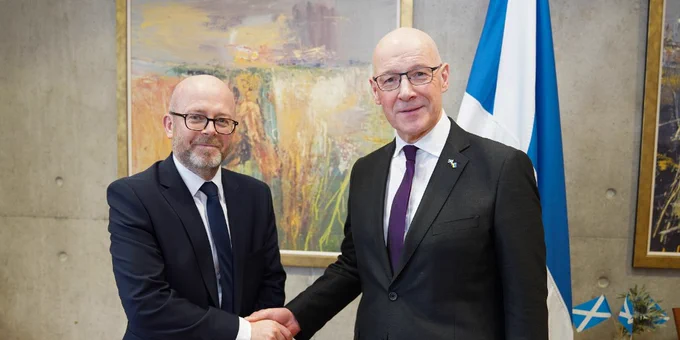 New Permanent Secretary Joe Griffin is congratulated by First Minister John Swinney 