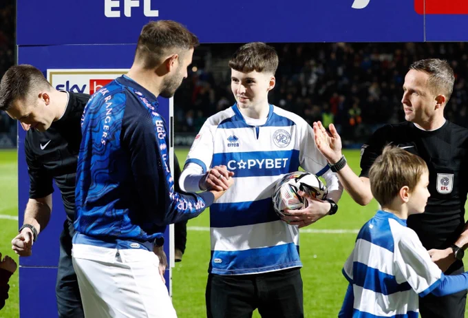 QPR Rainbow Rangers member Jay Hutchinson-May holds the EFL PUMA Rainbow Ball