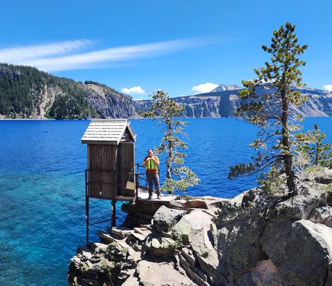 A hydrologic technician conducts a routine visit to Crater Lake near Crater Lake, Oregon. (Photo: Tom Craig, USGS Oregon Water Science Center) 