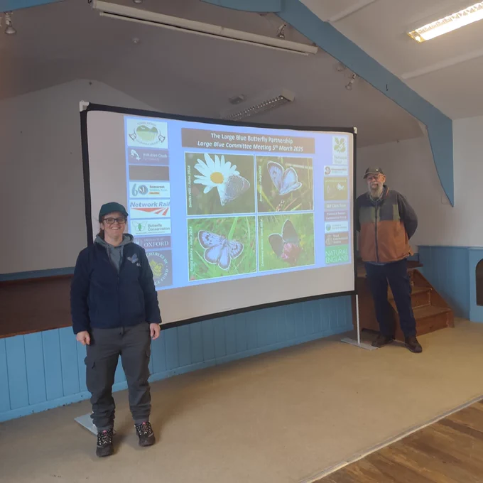RES conservation team members Sarah Meredith and David Simcox setting up the Large Blue Butterfly Committee Meeting presentations