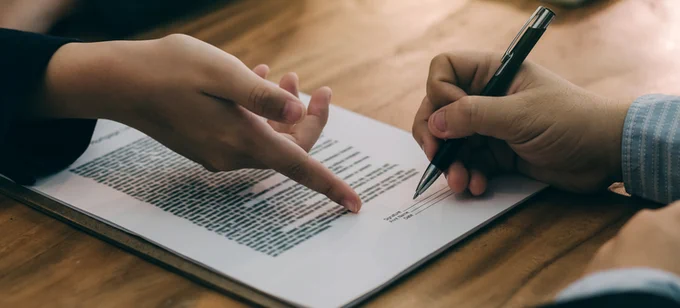 Signing an agreement.