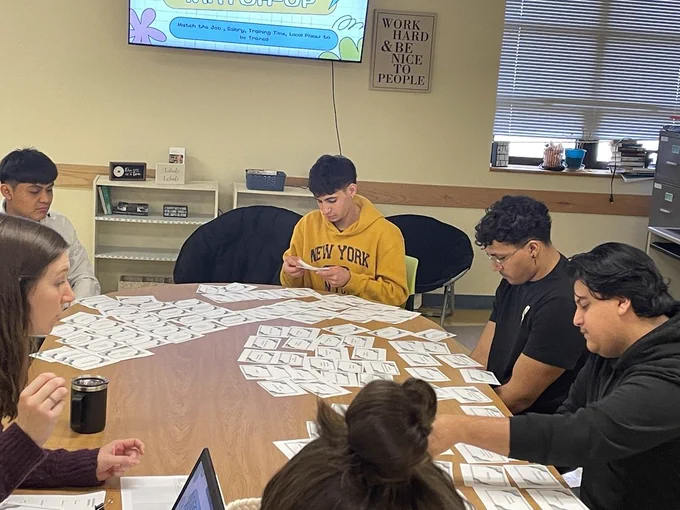 Students working around a table