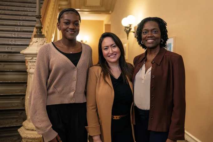Chancellor Aviles-Ramos poses with a student recipient of the "We Rise" scholarship at a Women's History Month celebration.