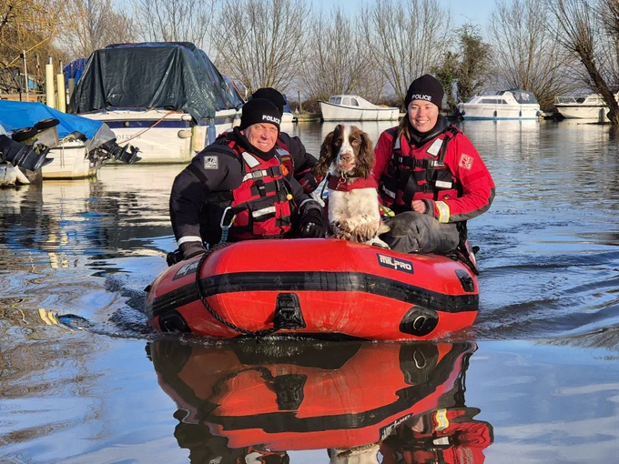 PC Jess with a colleague and PD Eggsy on the water