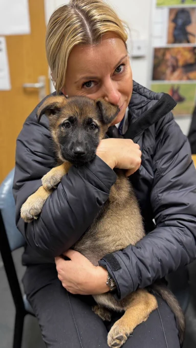 T/Supt Elena Hall with a puppy