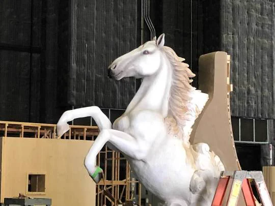 Picture of a white unicorn being built on the front of the Revenge Boat. part of David's BTS image dump from 03/03/25