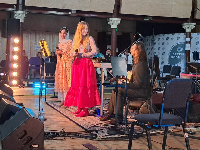 Duet with an Irish female musician and Afghan female musician on the stage