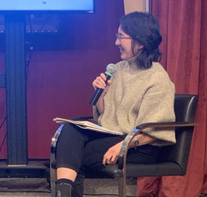 Prof. Anita Say Chan sitting during conversation of q and a following her lecture.