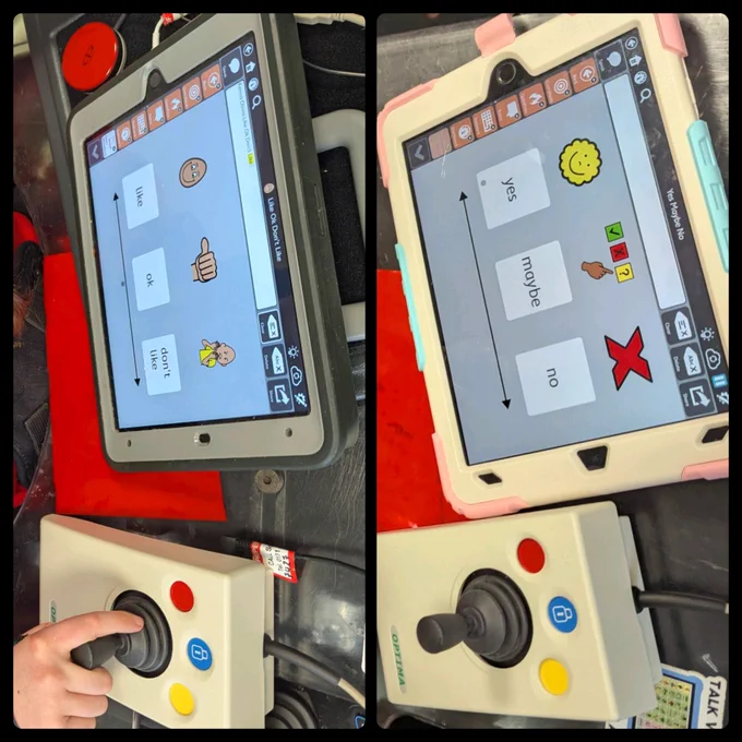 Collage of two photos. Each photo includes a tablet displaying a communication app and a joystick control. In the left photo, the tablet screen displays three options with corresponding images: "like" with a smiling face, "ok" with a thumbs-up, "don't like" with a frowning face. Below the tablet, there is a joystick with a red button, a yellow button, and a blue button. A hand is seen pressing the joystick. In the right photo, the tablet screen displays three options with corresponding images: "yes" with a smiling face, "maybe" with a hand showing a "maybe" gesture, and "no" with a red X. Below the tablet, there is the same joystick control.