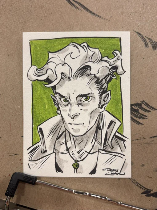 Ink and marker sketch of a man with deep set eyes and tall hair wavy hair, almost reminiscent of a chanterelle mushroom
