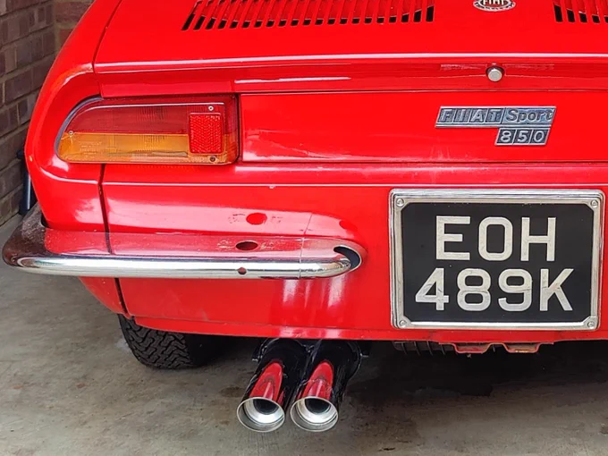 A Fiat 850 Spider, close up of rear end and exhaust 