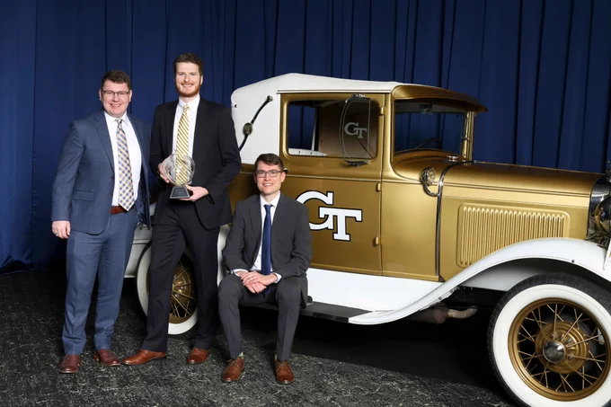 SlateSafety's Zachary Braun, Joseph Boettcher, and Tyler Sisk with the Ramblin' Wreck at the College of Engineering Alumni Awards and Induction Ceremony.