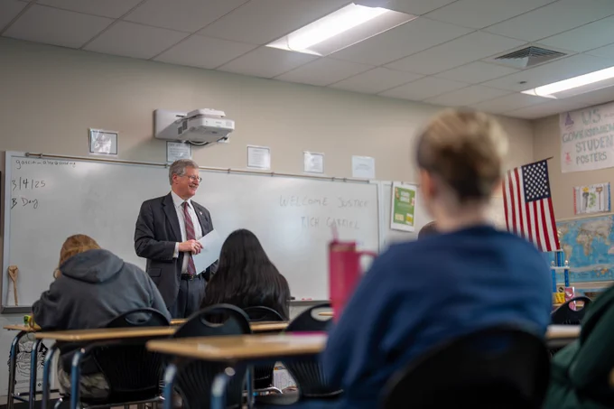 Colorado Supreme Court Justice Richard Gabriel speaks to Mead High government students