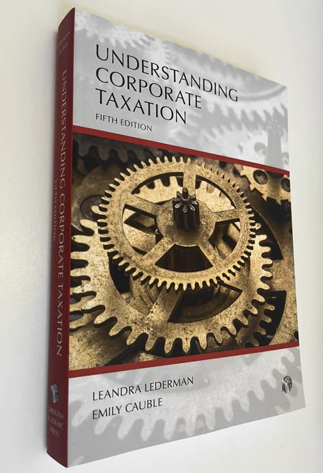 A book in Carolina Academic Press’s “Understanding” series for students and attorneys. The book is light gray with a bronze gear on the cover. The cover has deep red trim and binding. It is a fairly thick book. It says it’s the fifth edition. The authors’ names, Leandra Lederman and Emily Cauble, also appear on the cover.