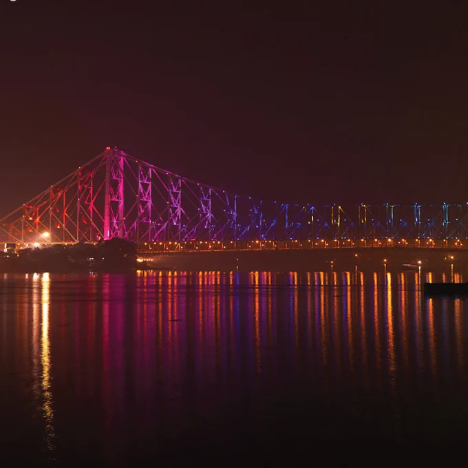 Lastly, we'll end out tour in Kolkata, West Bengal, India. The iconic Howrah Bridge shines beautifully for locals, commuters and tourists alike thanks to Color Kinetics lighting system, which also reduced CO2 emissions by nearly 70 kg CO2e!
