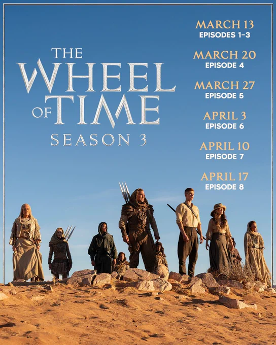 Rand al'Thor (Josha Stradowski), Moiraine Damodred (Rosamund Pike), and Lan Mandragoran (Daniel Henney) stand alongside Aiel gazing out across a rocky, sunlit desert. The Wheel of Time Season 3 logo fills the left side of the sky, and the text on the right reads: "March 13 Episodes 1-3, March 20 Episode 4, March 27 Episode 5, April 3 Episode 6, April 10 Episode 7, April 17 Episode 8".