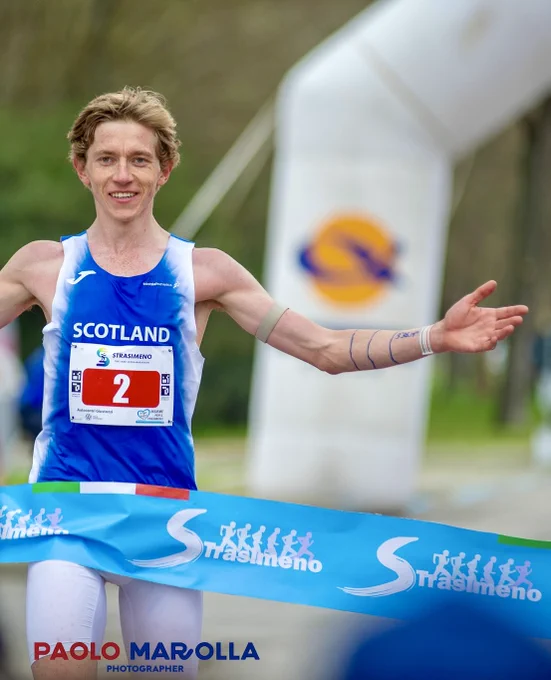 Henry Hart winning the Strasimeno 58km race .