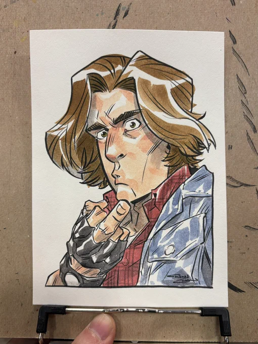 Watercolor portrait of John Bender from The Breakfast Club. He's a man with brown hair, denim jacket and leather gloves. He's flipping off the viewer.
