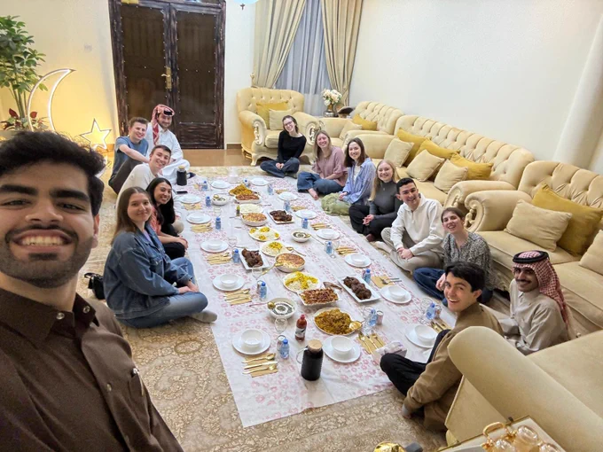 A group of people seated for an Iftar dinner.