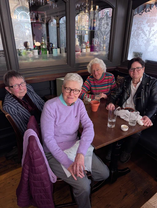 4 women at a table in a pub